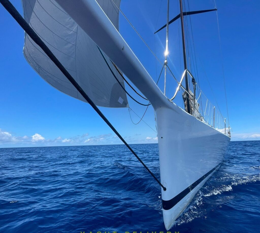 A white yacht on a delivery in New zealand with blue sea and sky