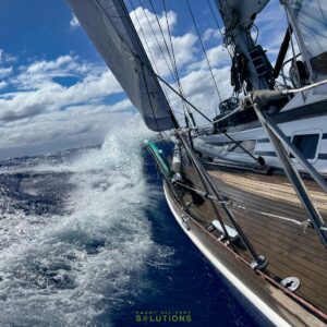 Swan 60 beating in the south Pacific the view is from outside the cockpit looking forward under the sail taken by the delivery skipper
