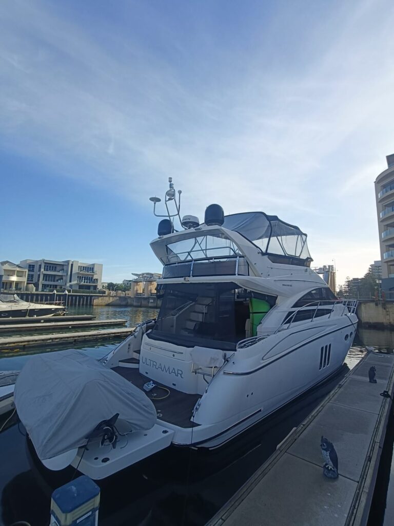 Princess P50 tied to a dock refuelling during a delivery