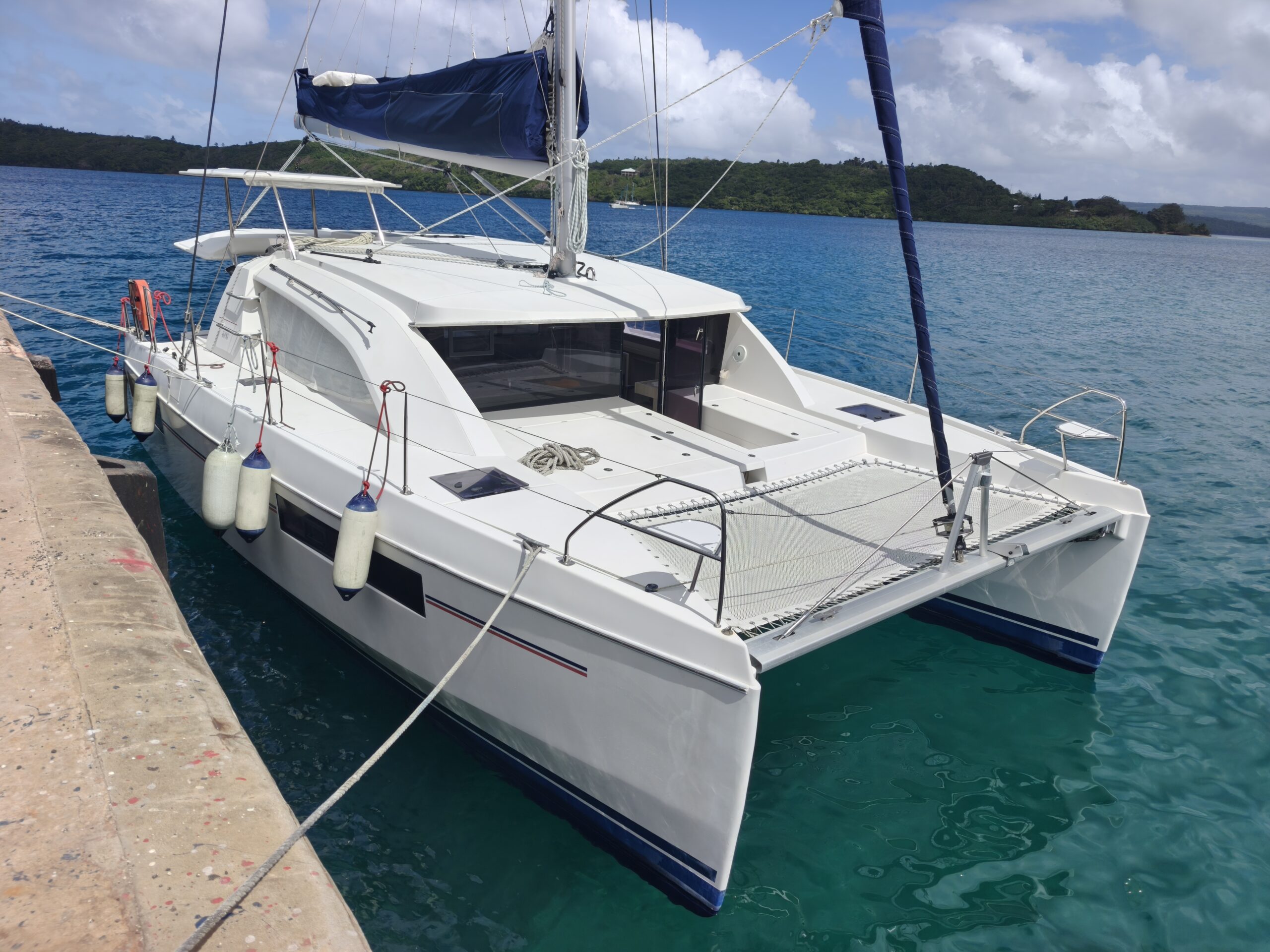 white leopard 40 tied to a concrete wharf during a yacht delivery