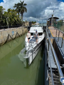 Pacific 62 on a yacht delivery in a lock waiting to enter a marina
